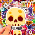Cute yellow cartoon skull Halloween sticker, 2-inch size held by hand for scale - 50Pcs Halloween Set