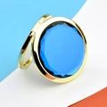 Portable golden metal compact mirror featuring a faceted blue crystal jewel inlay - Gold Crystal Dark Blue