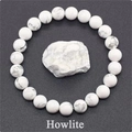 Macro detail of natural white howlite beaded stretch bracelet with grey marble veins - Howlite