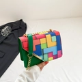 Chic green crossbody bag with colorful geometric puzzle print and gold chain strap - Green