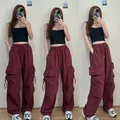 Men's wide-leg cargo pants in wine red color featuring elastic waist and side pockets - S / Burgundy