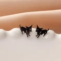 Minimalist black dog silhouette stud earrings with glossy enamel finish on white plate - Running Puppy (781) / Black