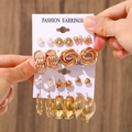 Golden earrings set featuring pearl studs and geometric hoops on a white card display - 29 KC Gold