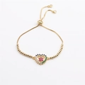 Bracciale a cuore dorato regolabile con pietre di zirconia colorate su sfondo bianco - Catena Veneziana Con Grani
