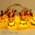 Christmas LED string lights with 10 glowing yellow cartoon ducks wearing reindeer antlers - Reindeer Duck (1.8m 10 LEDs - 2AA Constant Light Battery Box)