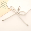 Elegant white faux leather bow charm with silver metal clasp and sentimental message card - Leather Bow Charm / White