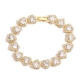 Luxurious gold plated heart bracelet with sparkling cubic zirconia on white background - Gold Bracelet