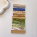 Close-up of assorted colorful high-elasticity braided hair ties on display cards - Bamboo Texture Green Color Set / 32 Pieces