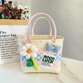 Pink and blue checkered woven picnic tote bag with cute floral and bow decorations - Sunflower Bow Decoration / Beige Main Color Horizontal Stripe