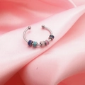 Detailed close-up of rotating colorful enamel beads on a silver spinner ring for anxiety - Adjustable Open / Colorful Gradient Beads