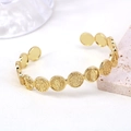 Adjustable gold plated brass religious bangle with embossed coin motifs and vintage style - Gold