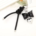 Porte-clés nœud en cuir PU noir tendance avec pendentif cœur argenté et étoile - Porte-clés Nœud Cœur en Cuir (Noir) / Noir