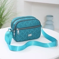 Teal quilted Oxford cloth crossbody bag with multi-layer zippers and adjustable strap - Lake Blue