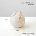 White ceramic snowflake night light with gold bow detail, 9.4cm decorative Christmas lamp - Christmas Ball