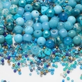 Macro view of assorted blue glass seed beads and tubes for DIY jewelry making - Lake Blue Series