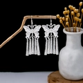 Ethnic style silver butterfly earrings with long vintage tassels hanging on a wood branch - Hollow Butterfly Long Tassel Style (E5887)