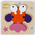 3D wooden fish puzzle for kids with orange body and colorful shapes on base - Goldfish with Buckle