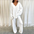 Detail of white V-neck knitted sweater and wide-leg trousers lounge set in soft plush texture - White