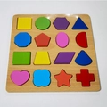 Colorful wooden shape sorter puzzle toy for toddlers with 16 vibrant geometric blocks - Shape Sorting Board