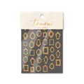 Macro detail of gold foil embossed nail stickers featuring vintage ornate frame designs - Gold