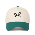 Detailed shot of the bow embroidery on a two-tone cream and dark green trucker hat - Adjustable / Dark Green