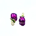 Detailed close-up of purple fruit enamel charms with green leaves and golden loop rings - Eggplant #2