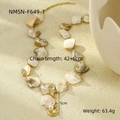 Detail view of shell necklace with starfish charms and dimension info 42+6cm - White Shell Necklace