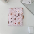 Detail view of pink quilted fabric sanitary pouch with cute cartoon bear pattern - Happy Bear
