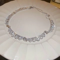 Elegant silver teardrop necklace with shimmering zircon stones on a white ceramic plate - Silver Lace Inlaid Rhinestone Necklace