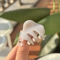 Detail showing creamy white mini hair claw clip held in hand for size visualization - Cement Gray-Cloud Style