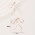 Minimalist gold bow drop earrings in a French style with precise size measurements - Gold