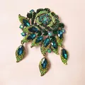 Baroque vintage flower brooch with green crystals and teardrop pendants on pink backdrop - Style 1 (Green Blue Rhinestone Rose)