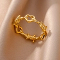 Golden hollow heart ring with wire mesh texture on premium champagne silk fabric - Adjustable Open / Heart Line (JZ4885G)