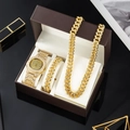 Detalle de set de reloj dorado, collar cubano y pulsera en una caja de regalo de lujo - Dorado