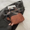 Brown faux leather square crossbody bag with floral embossing and ethnic wide strap - Brown