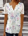 Close-up of V-neck white floral top with lace hollow sleeves and decorative buttons - S / Tops / Pink Floral - Short Sleeve