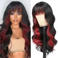 Long wavy ombre black and red synthetic wig with bangs for women shown on model - Black with Red Highlights