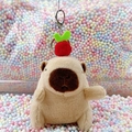 Brown Capybara plush keychain featuring a red fruit hat on colorful foam balls - Light Brown Apple + Silver Clip