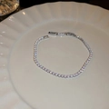 Close-up of a silver tennis bracelet with artificial gems on a white ceramic plate - 2# Silver Small - Square