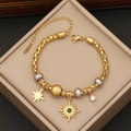 Detailed view of a gold stainless steel chain bracelet with star and sun charms - Star Sunburst Gemstone Style (6#)