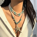 Detail of multi-layer boho necklace featuring large gold starfish pendant and pearls - Starfish Style (6357) / Gold