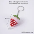 Pink strawberry keychain with chocolate glaze and white stripes, 4.7cm height, 18g weight - Red Jam - White Strawberry (Keychain)