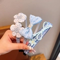 Handheld set of blue fabric girl's headbands with polka dot flowers and checkered bows - 10# Blue Bow