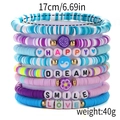 Detail of colorful polymer clay bead bracelets with gold accents and positive letter beads - Sy0327-1