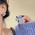 Close-up of sparkling crystal flower stud earrings worn by a model for a classy look - Grey Four-Petal Flower Style (5#)