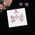 Close-up of colorful facial rhinestone stickers in geometric shapes on display card - Multicolor/Aurora Colorful