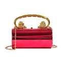 Fuchsia acrylic box clutch featuring golden lion head handles and a chain strap - Rose Red