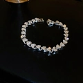 Elegant silver heart bracelet with pave-set rhinestones on a dark reflective background - Heart Style (22#)