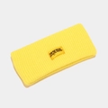 Close-up of yellow ribbed knit headband showing elastic texture and embroidered patch - One Size / Light Yellow