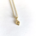 Minimalist gold necklace with 3D letter Q pendant on a clean white background - Letter Q